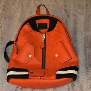 Orange backpack purse